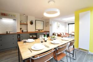 a kitchen and dining room with a table and chairs at 37 Stradbroke Road, Southwold in Southwold