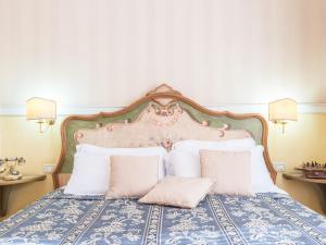 Кровать или кровати в номере Il Gattopardo Relais