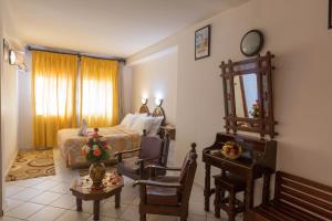 Postel nebo postele na pokoji v ubytování Hotel Sindibad