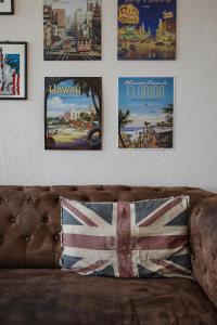 a couch with a picture of a man on it at Holidayapartments Marquardt in Berlin