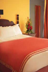 Ein Bett oder Betten in einem Zimmer der Unterkunft Hotel Bakoua Martinique
