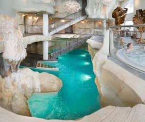 a water slide in a hotel with a swimming pool at Arc 1950 Résidence 5* Sources de Marie 4/6 pers in Arc 1950