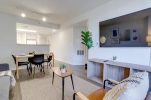 a living room with a couch and a table at Sensational 1 Bedroom Condo At Ballston place With Gym in Arlington