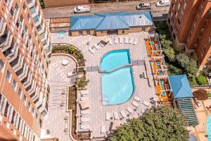 an overhead view of a swimming pool in a city at Sensational 1 Bedroom Condo At Ballston place With Gym in Arlington
