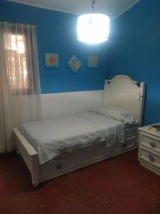 Ένα ή περισσότερα κρεβάτια σε δωμάτιο στο Casa temporal para 7 personas +10 φωτογραφίες