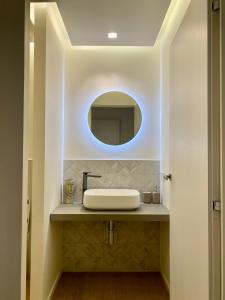 a bathroom with a sink and a mirror at Torino 64 - Duomo City Center Luxury Apt Perfect x2! Self Check-In in Milan