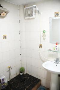 a bathroom with a sink and a shower at HOSTEL TURBO in Hanoi