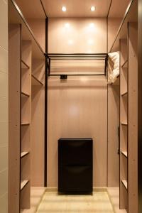 a room with a bed and a tv in a closet at VALERIA-DREAMS San Pablo in Zaragoza