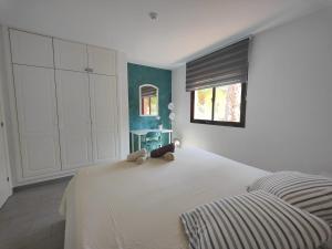 Łóżko lub łóżka w pokoju w obiekcie Corralejo Happy Place, precioso apartamento con piscina