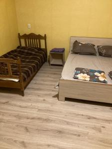 Postel nebo postele na pokoji v ubytování Guest House Econom