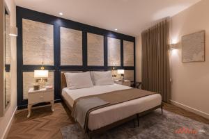 Letto o letti in una camera di El Doris Boutique Living