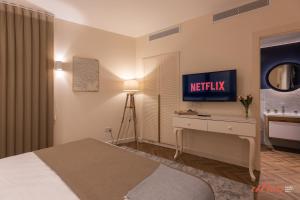 Letto o letti in una camera di El Doris Boutique Living