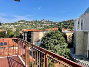 a balcony with a view of a city at Casa Berizzi - Santa Lucia in Bergamo