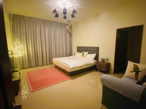Cama ou camas em um quarto em 鸚鵡民宿