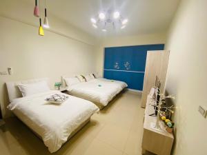 Cama ou camas em um quarto em 鸚鵡民宿