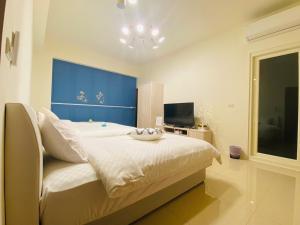 Cama ou camas em um quarto em 鸚鵡民宿