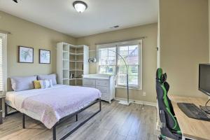 a bedroom with a bed and a desk and a computer at Family-Friendly Home in Hoover with Backyard! in Hoover