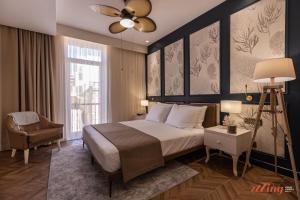 Letto o letti in una camera di El Doris Boutique Living