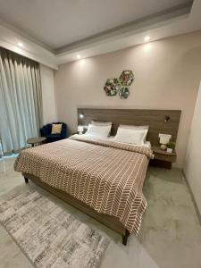 Katil atau katil-katil dalam bilik di Flock Hotel I Golf Course Road Near Dlf Phase 1 Metro station I Gurugram