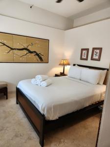 a bedroom with a large bed in a room at Mantell Plaza Apartments in Miami Beach