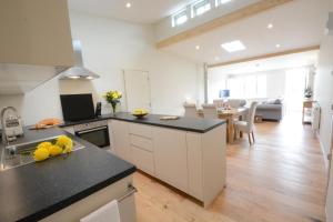 a kitchen with a counter and a dining room at Muddy Pig, Ubbeston in Laxfield