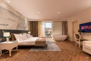 Letto o letti in una camera di El Doris Boutique Living