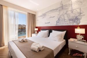 Letto o letti in una camera di El Doris Boutique Living