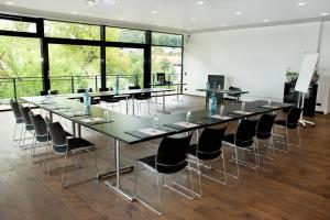 a large conference room with a long table and chairs at Hotel Antoniushütte in Balve