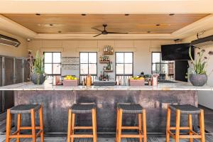 a bar in a restaurant with stools at The Piccolo in Paso Robles