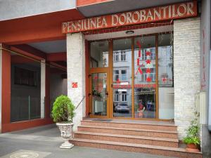 a store front of a building with a sign on it at Vila Dorobantilor in Cluj-Napoca