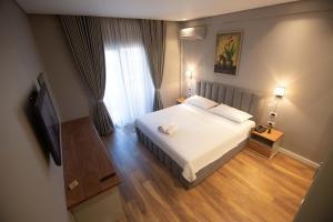 Postel nebo postele na pokoji v ubytování Vila Mariss