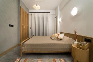 a bedroom with a bed with two pillows on it at Narev Kırkpınar Sapanca in Sapanca +16 photos