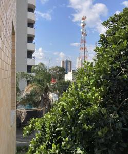 a view of the city from a building with trees at Hotel Acalanto in Feira de Santana