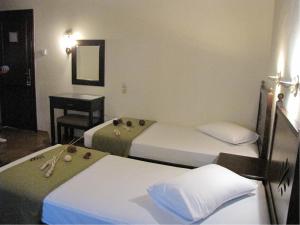 Postel nebo postele na pokoji v ubytování Hotel Mirovoli