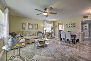 a living room with a couch and a table at Cozy Sarasota Retreat - 3 Blocks to the Coast! in Sarasota
