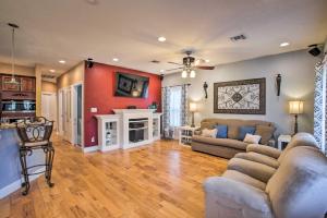 a living room with a couch and a tv at Waveland Family House, 4-Minute Drive to the Beach in Waveland
