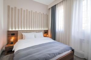Voodi või voodid majutusasutuse Veneti Suites toas