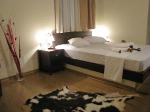 Postel nebo postele na pokoji v ubytování Hotel Mirovoli