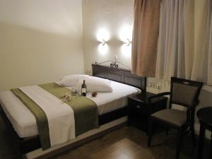 Postel nebo postele na pokoji v ubytování Hotel Mirovoli