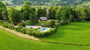an aerial view of a garden with a swimming pool at FeWo Fritz in Bad Hindelang
