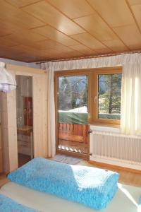 Postel nebo postele na pokoji v ubytování Haus Bergwelt