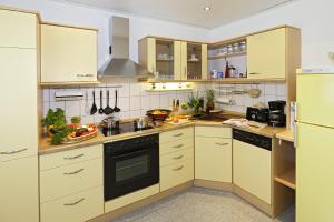 Una cocina o zona de cocina en Management - Business Suiten