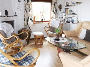 a living room with chairs and a table at 6 person holiday home in KNÄRED in Knäred
