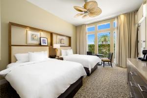 a hotel room with two beds and a window at Hyatt Regency Indian Wells Resort & Spa in Indian Wells