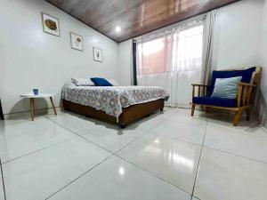 Ein Bett oder Betten in einem Zimmer der Unterkunft Departamento H González 2