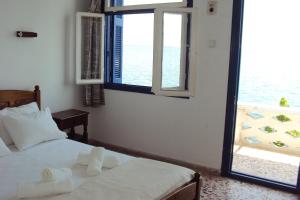 Posteľ alebo postele v izbe v ubytovaní Chrisopetro Rooms
