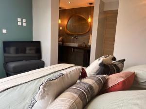 a person laying on a bed in a room at Les Petites Canailles Rooftop in Cayeux-sur-Mer