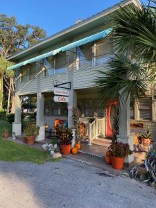 a house with pumpkins in front of it at Nature Coast Inn & Cottages in Inglis