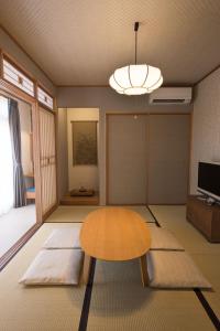 a living room with a table and a television at Izumo - House - Vacation STAY 13870v in Izumo