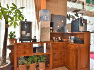 a wooden desk with a coffee maker on top of it at Suzuka Royal Hotel - Vacation STAY 38960v in Suzuka